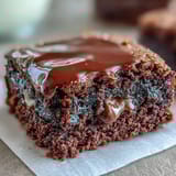 Rich chocolate brownies filled with creamy peanut butter cups, sliced into perfect squares for dessert.  