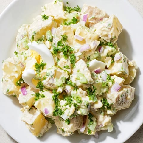 Chilled potato salad with vibrant celery and red onion, perfect for a summer BBQ.