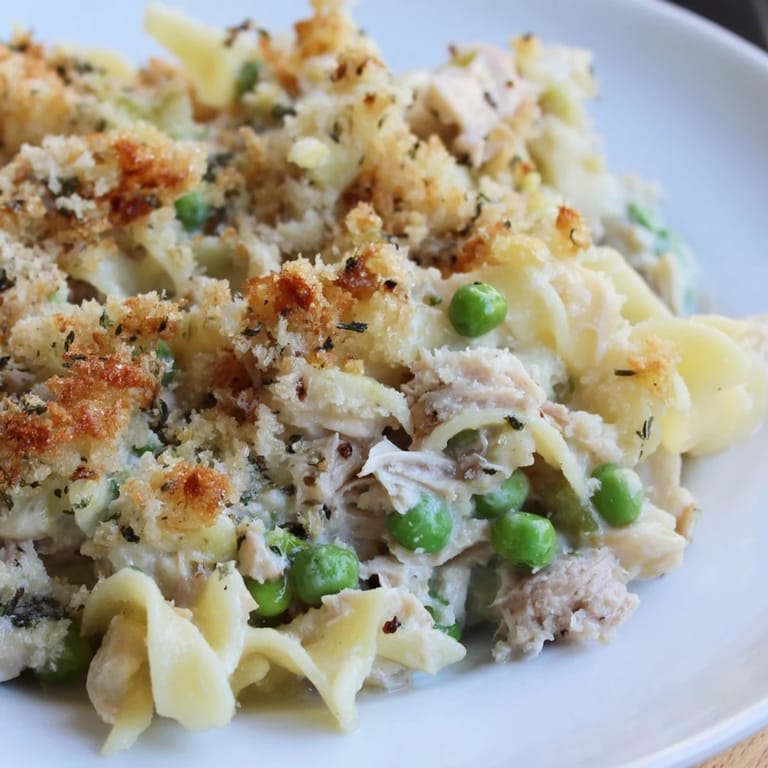 A close-up of creamy Tuna Casserole with a crispy, golden breadcrumb topping ready to serve.